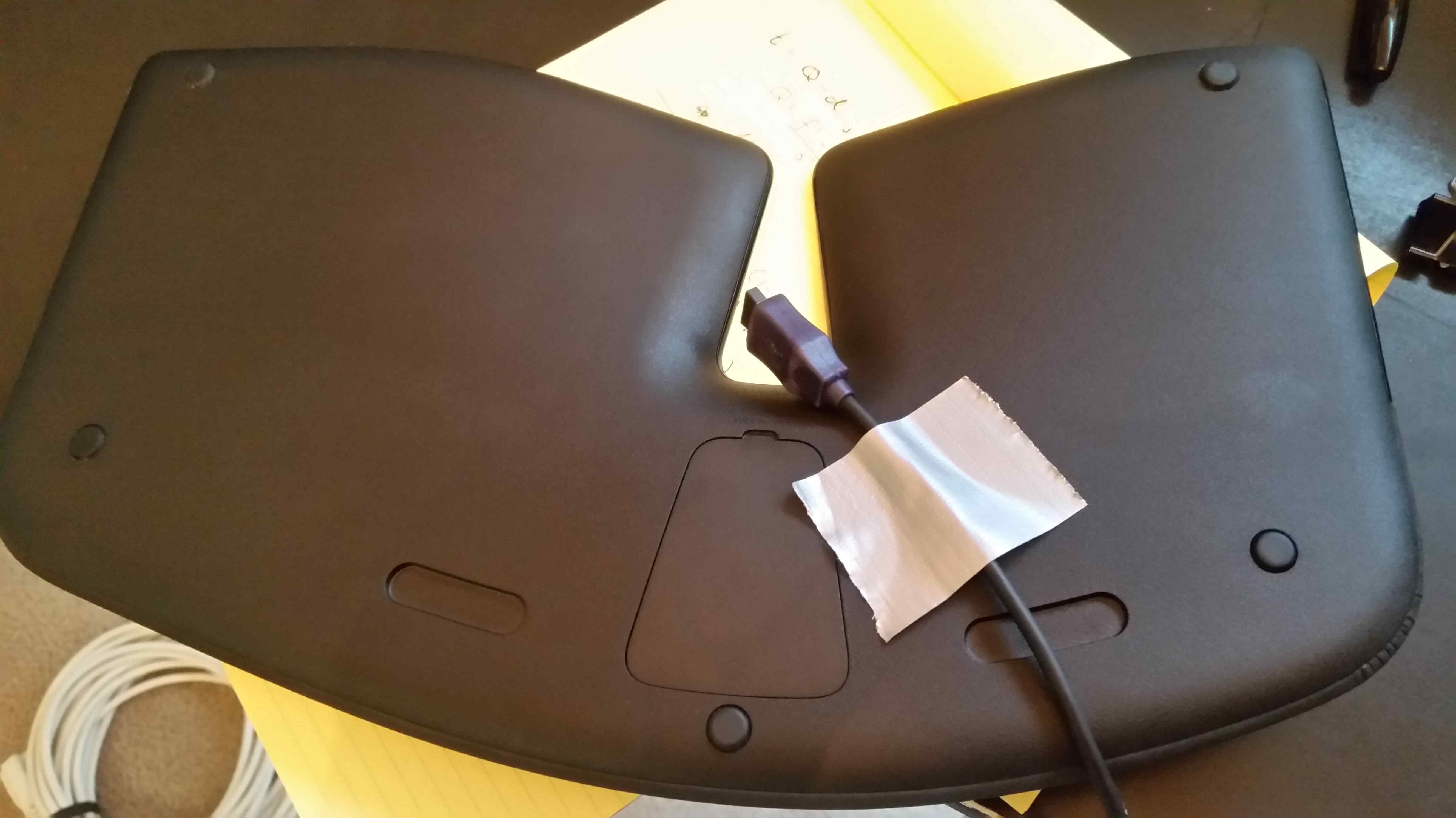 Sculpt keyboard with receiver taped to back
